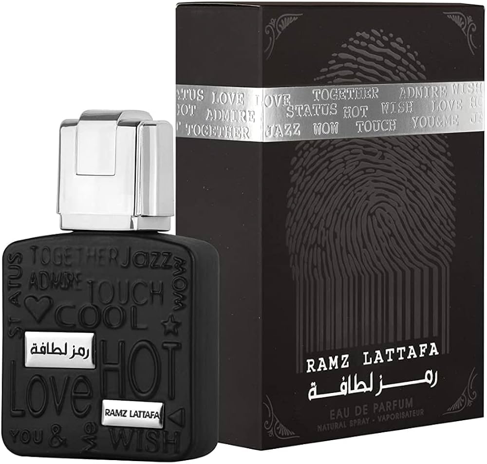 Lattafa Ramz Silver 100 ml bottle – fresh apple aromatic fragrance with vanilla amber woody base.