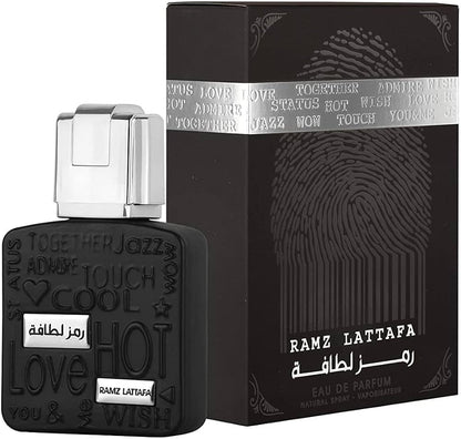 Lattafa Ramz Silver 100 ml bottle – fresh apple aromatic fragrance with vanilla amber woody base.