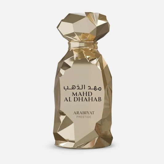 Gold perfume bottle labeled 'MAHD AL DHAHAB' by Arabiyat on a white background
